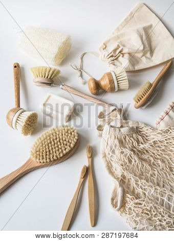 Dish Washing Brushes, Bamboo Toothbrushes, Reusable Bags On White Background. Sustainable Lifestyle 