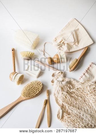 Dish Washing Brushes, Bamboo Toothbrushes, Reusable Bags On White Background. Sustainable Lifestyle 