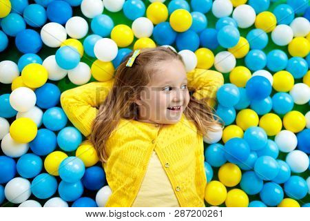 Kids Play In Ball Pit. Child Playing In Balls Pool