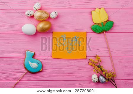 Bird Cookie And Easter Eggs. Golden And Styrofoam Easter Decorative Eggs. Flower Shaped Easter Cooki
