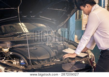 This Career Man Saleman Business Inspection Writing Note On Notepad Or Book, Paper With Car Blurry B