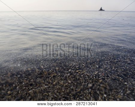Waves And Beautiful Sunset On The Greek Island Evia (euboea) In The Aegean Sea