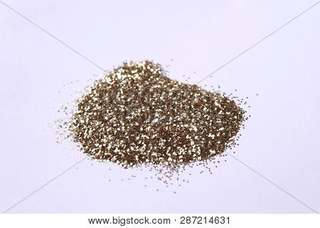 A Small Bunch Of Golden Nail Gritter For Manicure. Yellow Tone Glitter Shining On Daylight. Stock Ph