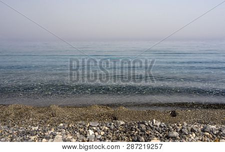 Waves And Beautiful Sunset On The Greek Island Evia (euboea) In The Aegean Sea
