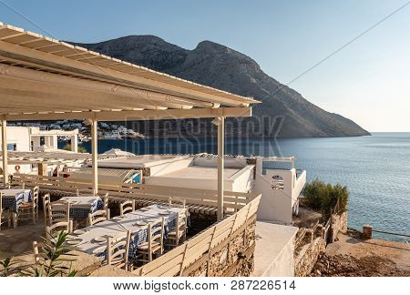 Sifnos, Greece - September 10, 2018: Traditional Greek Restaurant Overlooking The Bay Of The Island 