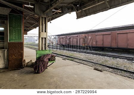 Thazi, Myanmar - 23 November, 2018: Wide Angle Picture Of Burmese People Sleeping At Thazi Train Sta