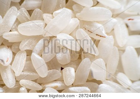 Background From White Rice Medium Closeup. Healthy Nutrition Whole Grains Coarse Grains