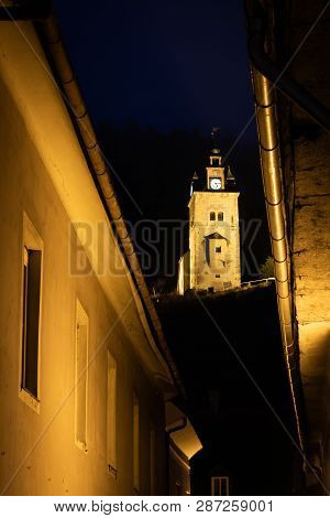 Look Between The Houses Of The Small Mining City Erzberg To Yellow Lighten Shift Tower Schichtturm O
