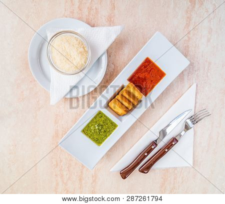 Traditional Spanish Food, Green And Red Mojo Sauce With Fried Bread And Parmesan Cheese