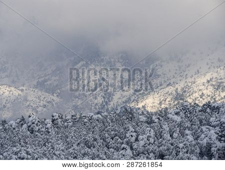 Panoramic View Of Snow Covered Mountain Dirfys And Sky With Clouds On A Sunny Day On The Island Of E