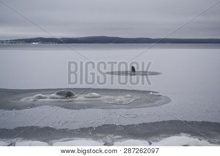 Melancholic Landscape With The Mystery Signs On The Frozen Lake