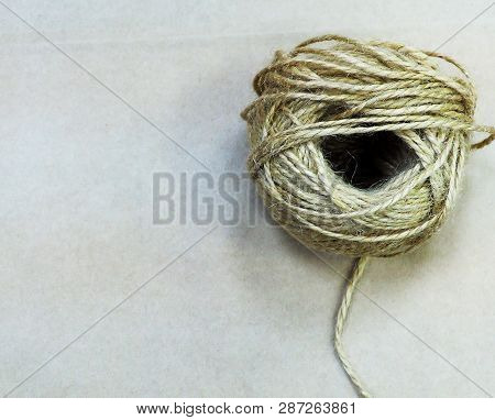 Natural Jute Twine Roll, Top View On White Wood Background. Diy Wrap Gift Hemp Rope Cord String Roll