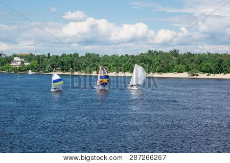 Regatta On Lake River Sailing Yachts Boats With White Sails And Multicolored Gennakers, Reflected Sk