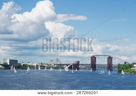 Regatta Competition On Lake River Sailing Yachts Boats With White Sails And Multicolored Gennakers,