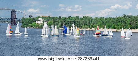 Regatta Competition On Lake River Sailing Yachts Boats With White Sails And Gennakers, Reflected Sky