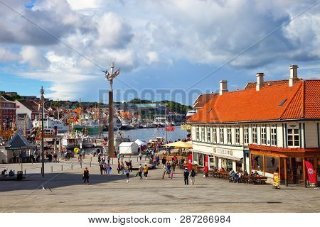 Stavanger, Norway - August 04, 2017: People At The Quay Port With Many Restaurants And Pubs In The C