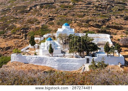White Churches With Blue Domes In The Cemetery Under Kastro Of Sifnos. Cyclades, Greece