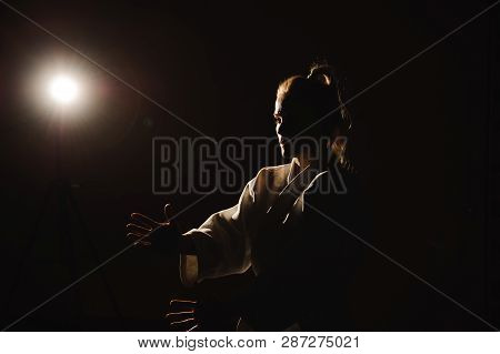 Young Girl Dressed In Hakama Practicing Aikido