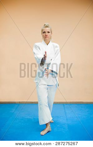 Young Girl Dressed In Hakama Practicing Aikido