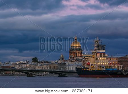 Sunset In Saint Petersburg Over The Neva River With The View Of The Blagoveshchenskiy Bridge And The