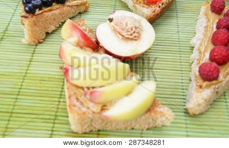 Different Delicious Toasts On Green Or Pink Crimson Background. Healthy Sandwich For Breakfast Or Sn