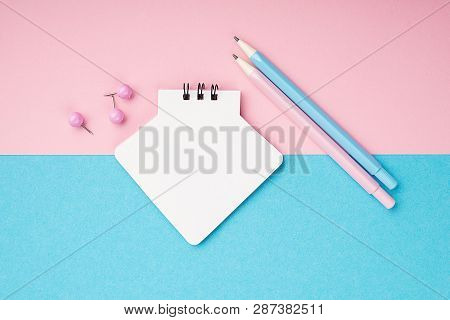 Empty Notebook Or Notepad On Pink And Blue Background With A Double Color Stationery. Creative Minim