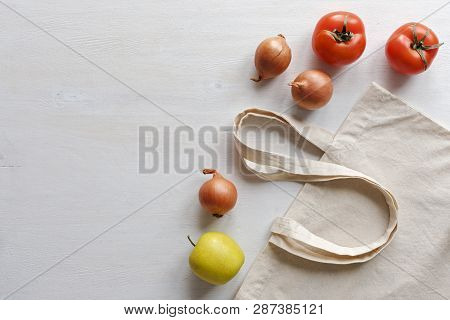Fresh Fruit And Vegetables With A Natural Fiber Re-usable Shopping Bag Isolated On White As A Side B