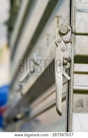 Close Up On Industrial Metal Made Handle Lock For Opening Semi Trailer