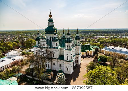 Landscape View Of Chernihiv On A Sunny Spring Day From A Height Against The Blue Sky And The Holy Tr