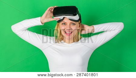 Beautiful Woman Wearing Virtual Reality Goggles In Studio. Woman Using Virtual Reality Headset. Woma