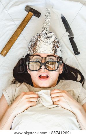 Silly Paranoid Woman Wears Tinfoil Hat And Sleeps With Weapon And Different Glasses Because Of Paran