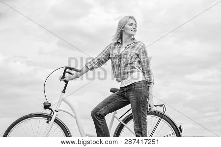 Active Leisure And Healthy Activity. Girl Ride Cruiser Model Bicycle. Woman Rides Bicycle Sky Backgr
