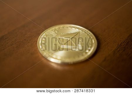 Golden Etherium Coin Close Up. Ether Is A Cryptocurrency Whose Blockchain Is Generated By The Ethere