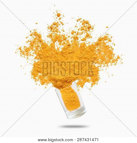 Condiment Splash. Yellow Turmeric Powder Flying, Isolated On White Background