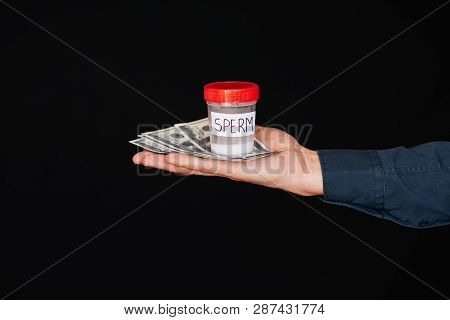 Bank Of Sperm And Money In The Hand Of A Man