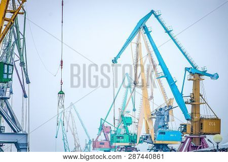 Indastrial Crane In Cargo Port At Winter