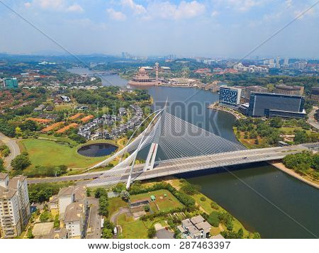 Seri Wawasan Bridge Or Putra Bridge And Putrajaya Lake With Blue Sky. The Most Famous Tourist Attrac