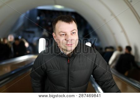 Man On Escalator In Subway