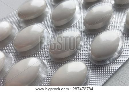White Viagra Pills In The Package Macro Image, A Medicine For All Diseases Close-up