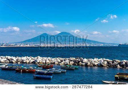 Gulf Of Naples With Wooden Fishing Boats And The Vesuvio At The Background
