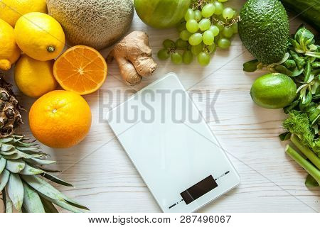 Flat Lay Composition With Kitchen Scales, Healthy Vegetables And Fruit On Wooden Background. Weight 