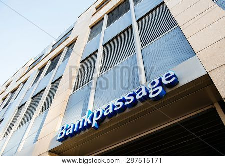 Karlsruhe, Germany - Oct 29, 2017: Bankpassage Sign On The Bank Building - Low Angle View Of Modern 