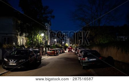 Strasbourg, France - Cot 13, 2018: French Street At Dusk With Multiple Houses And Cars Parked On The