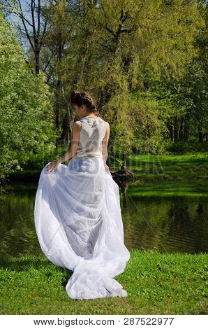 Oriental Woman In The White Long Dress