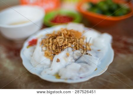 Traditional Vietnamese Banh Coun Street Food Meal Of Rice Stuffed Pancakes Decorated With Shallot. A