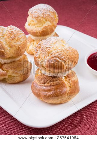 Baked French Desserts Suffed With Cream And Served With Jam