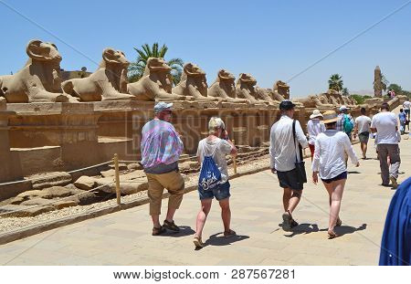 Karnak, Egypt - 17th May, 2018: Alley Of Sphinxes With Ram Heads. The Entrance To The Karnak Temple 