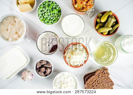 Super Healthy Probiotic Fermented Food Sources, Drinks, Ingredients, On White Marble Background Copy