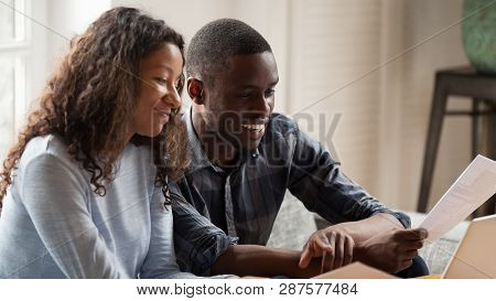 Happy Mixed Race Couple Check Paper Bills Paying Online
