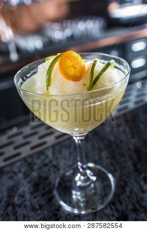 Cocktail Drink Frozen Margarita At Barcounter In Night Club Or Restaurant.